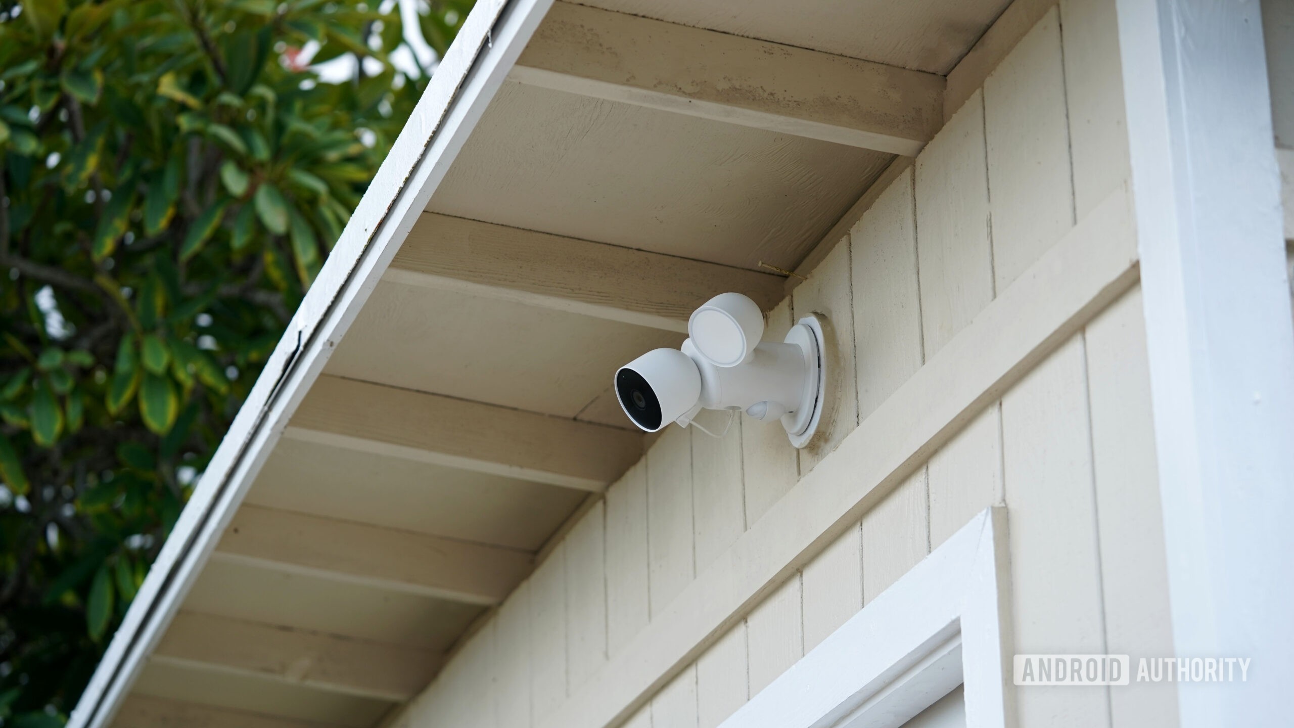 A Google Nest Cam with Floodlight aims at a user's side door.