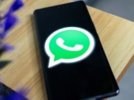 WhatsApp logo on a phone screen