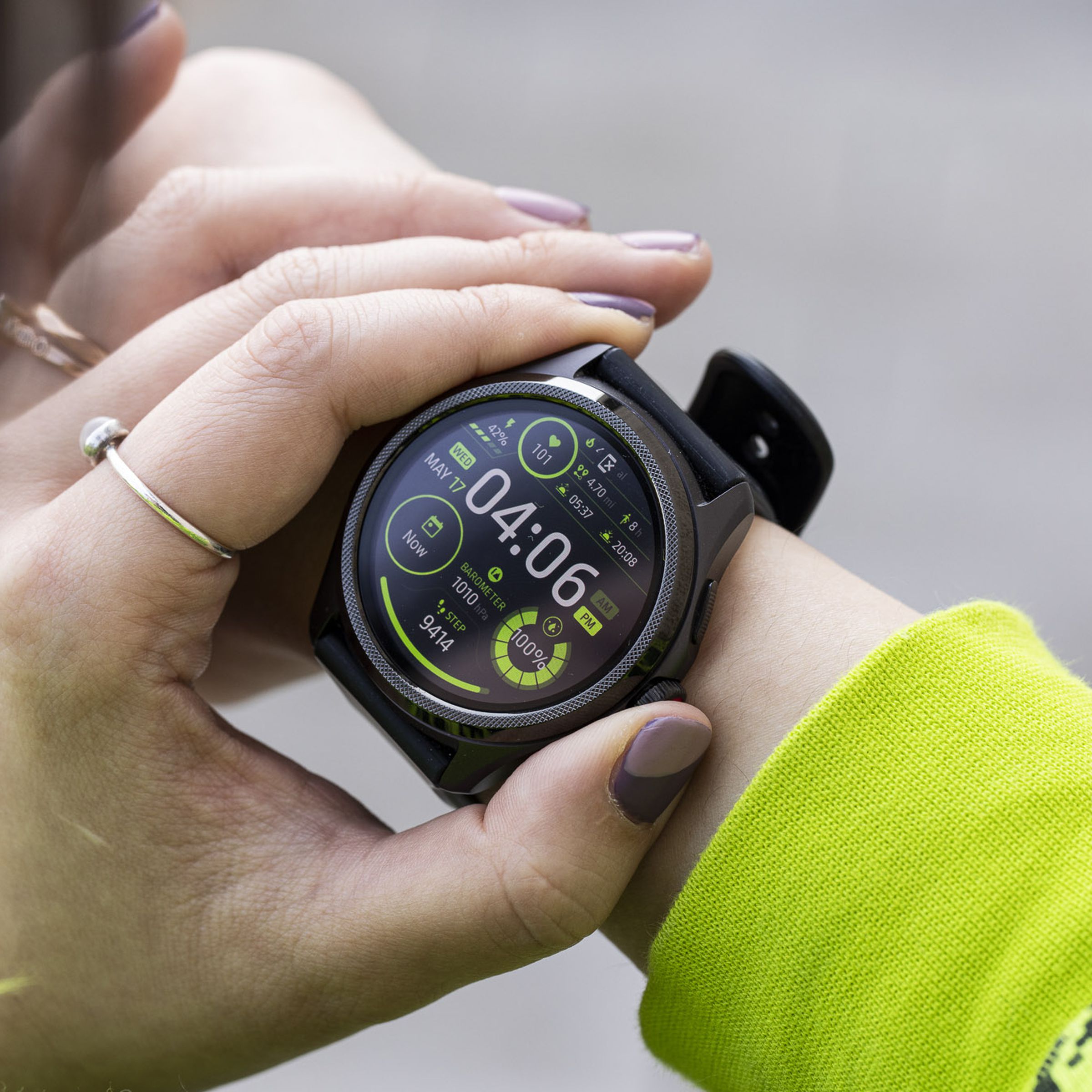 Close-up of person pressing the TicWatch Pro 5’s digital crown