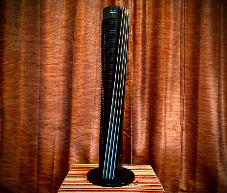 A black Vornado tower fan.