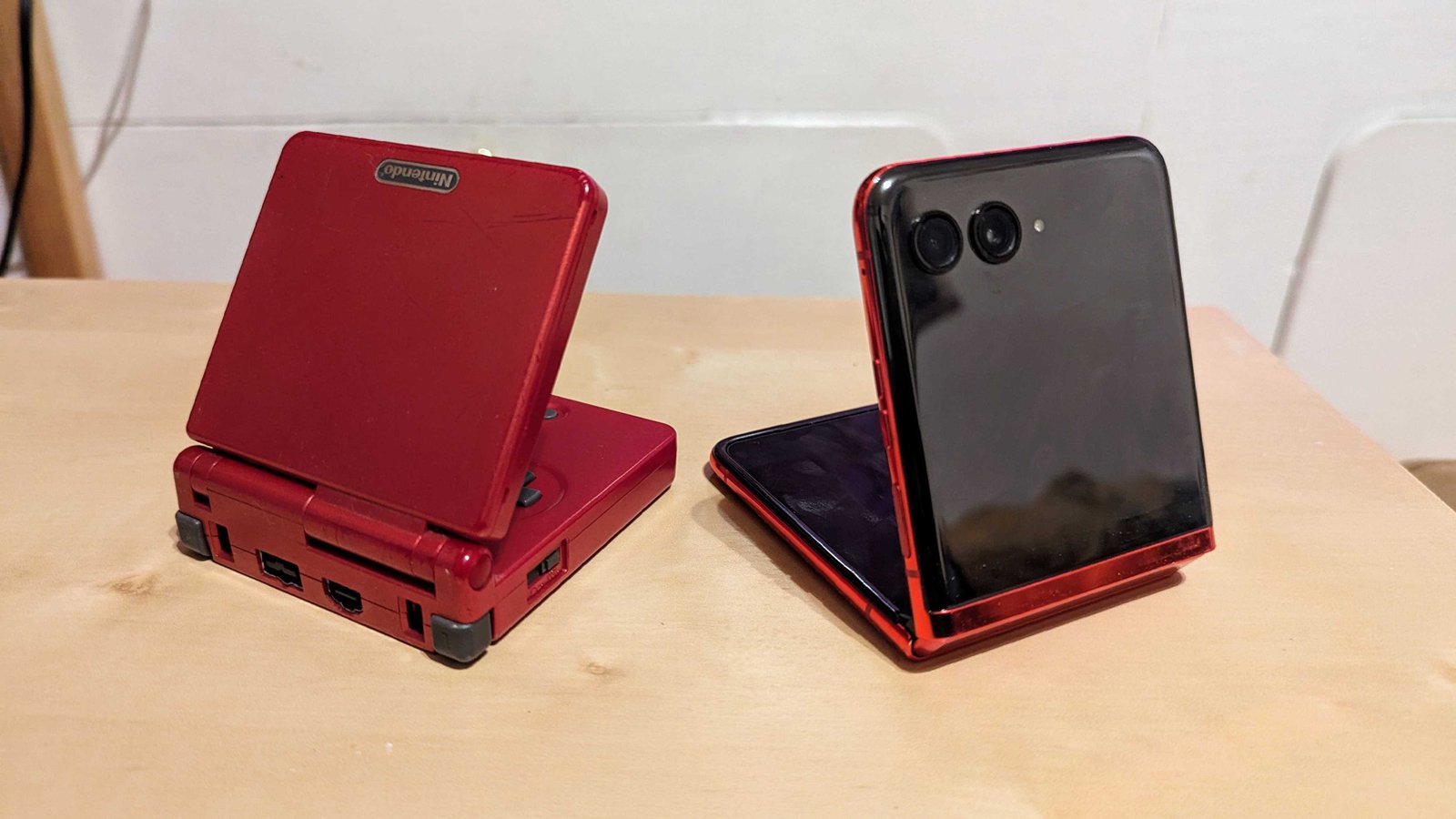 The Motorola Razr Plus 2023 next to a Game Boy Advance SP