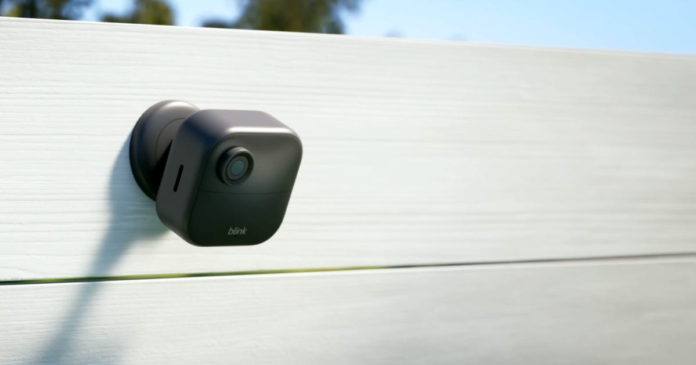 Best 4K Home Security Cameras for 2024 The wireless Blink Outdoor 4 security camera sits perched on a fence.