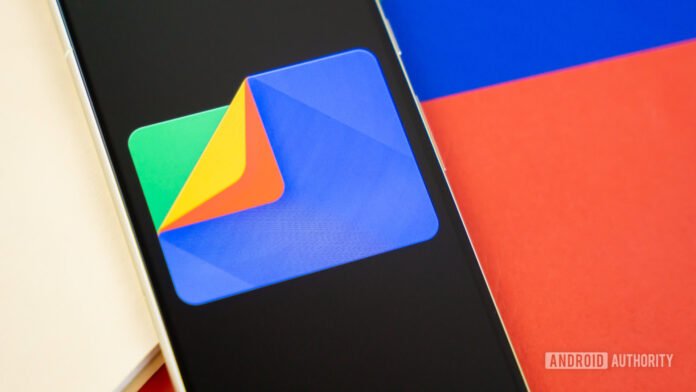 Files by Google gets a new sharing shortcut Google Files app logo on smartphone with manila folder and colorful background Stock photo 6