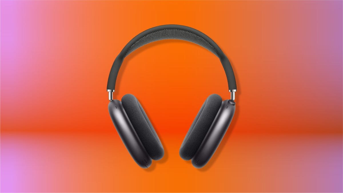 Gray Apple AirPods Max on an orange gradient CNET background.