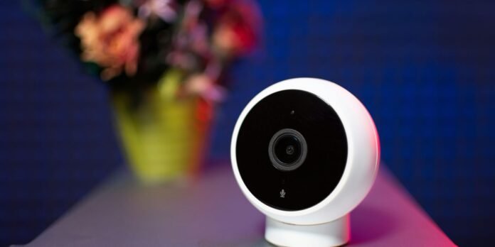 Ultimate privacy plus Apple Intelligence An Apple smart home camera will combine privacy with Apple Intelligence (Xiaomi camera shown on desk with flowers in vase)
