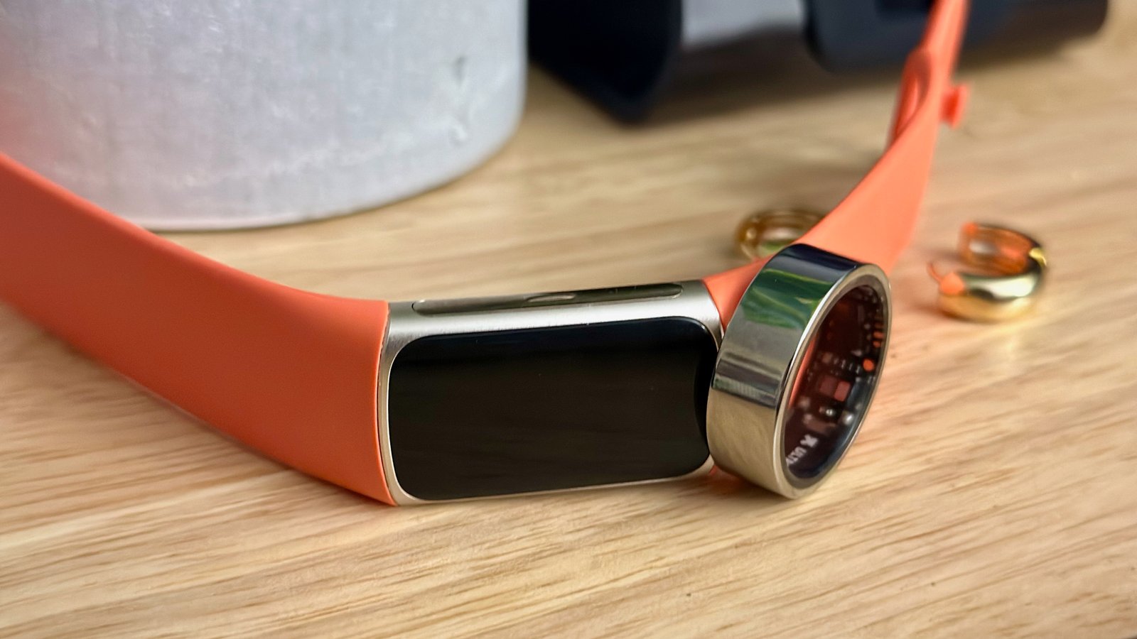 Black Friday smartwatch deal hunters will have to take a look at wise rings as an alternative 1 The Fitbit Charge 6 and a smart ring next to one another.