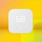 Shows the Amazon Smart Thermostat on a yellow background.