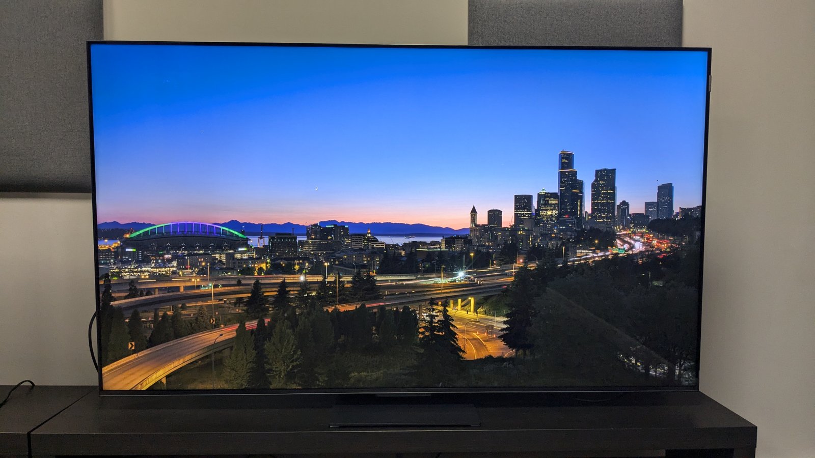 TCL C855 with landscape at dusk on screen