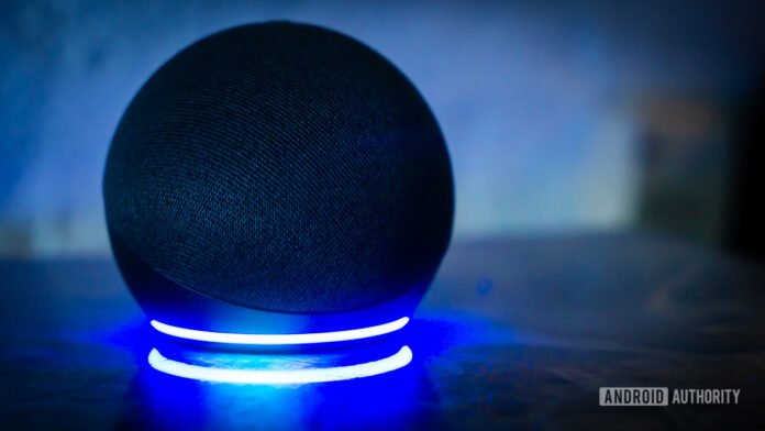 Hot deal: Get an Amazon Echo Dot and Echo Buds Amazon Echo Dot Alexa speaker with light ring turned on stock photo 1
