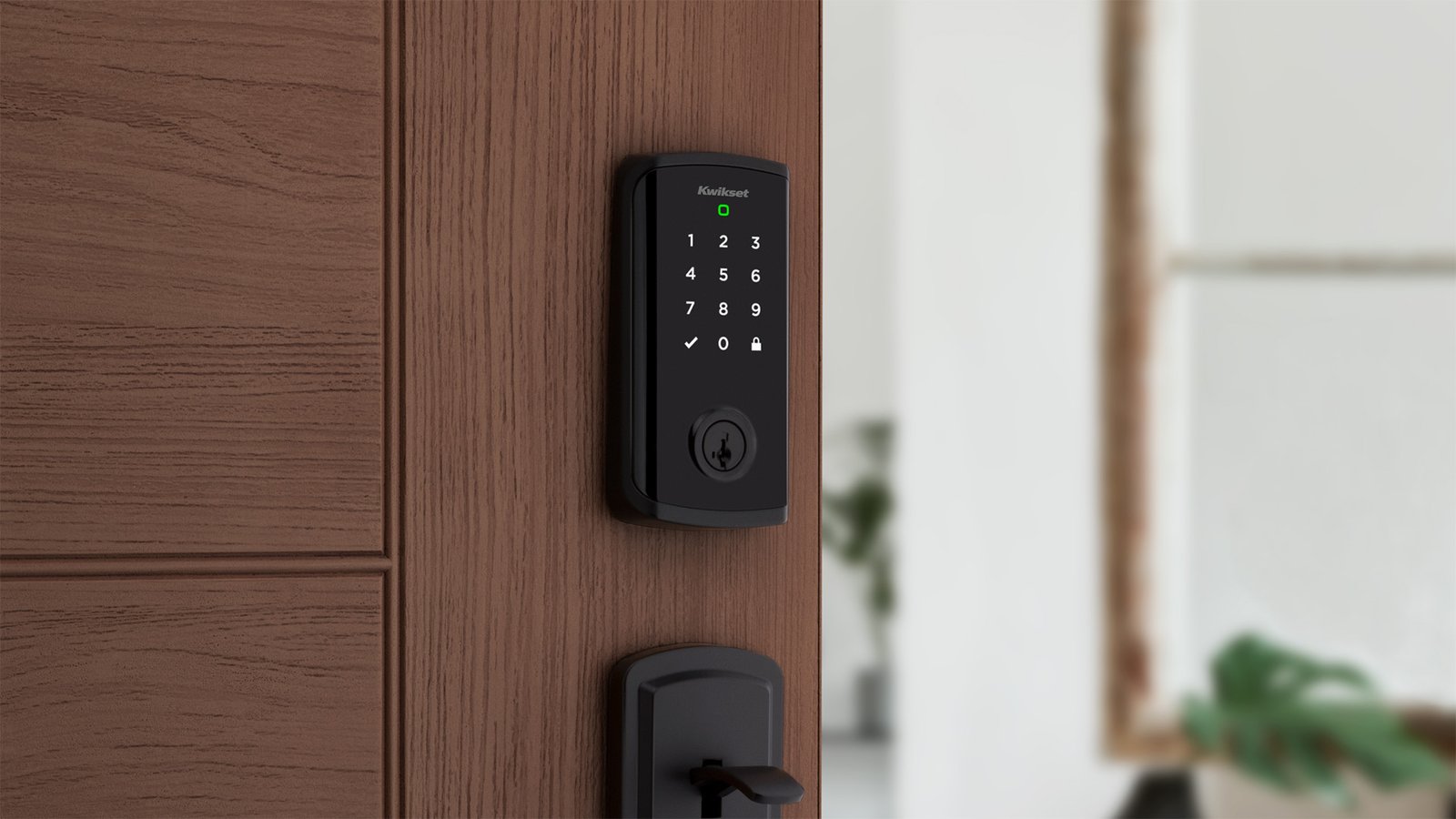 A black smart lock with a keypad on a brown door.