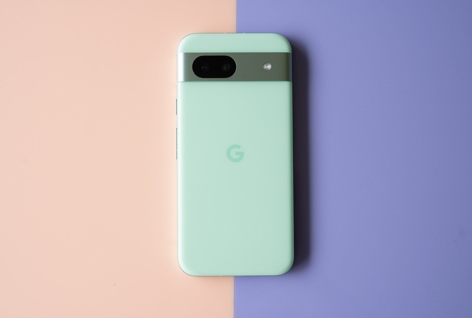 Google Pixel 8A in aloe green showing back panel.