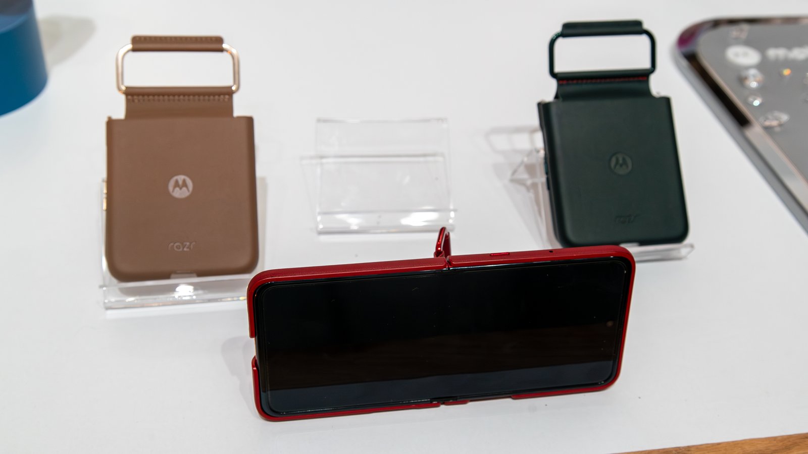 First 10 issues to do with the Motorola Razr 2025 collection 13 The Razr Ultra 2025 with a ring stand case on and two other cases on either side.