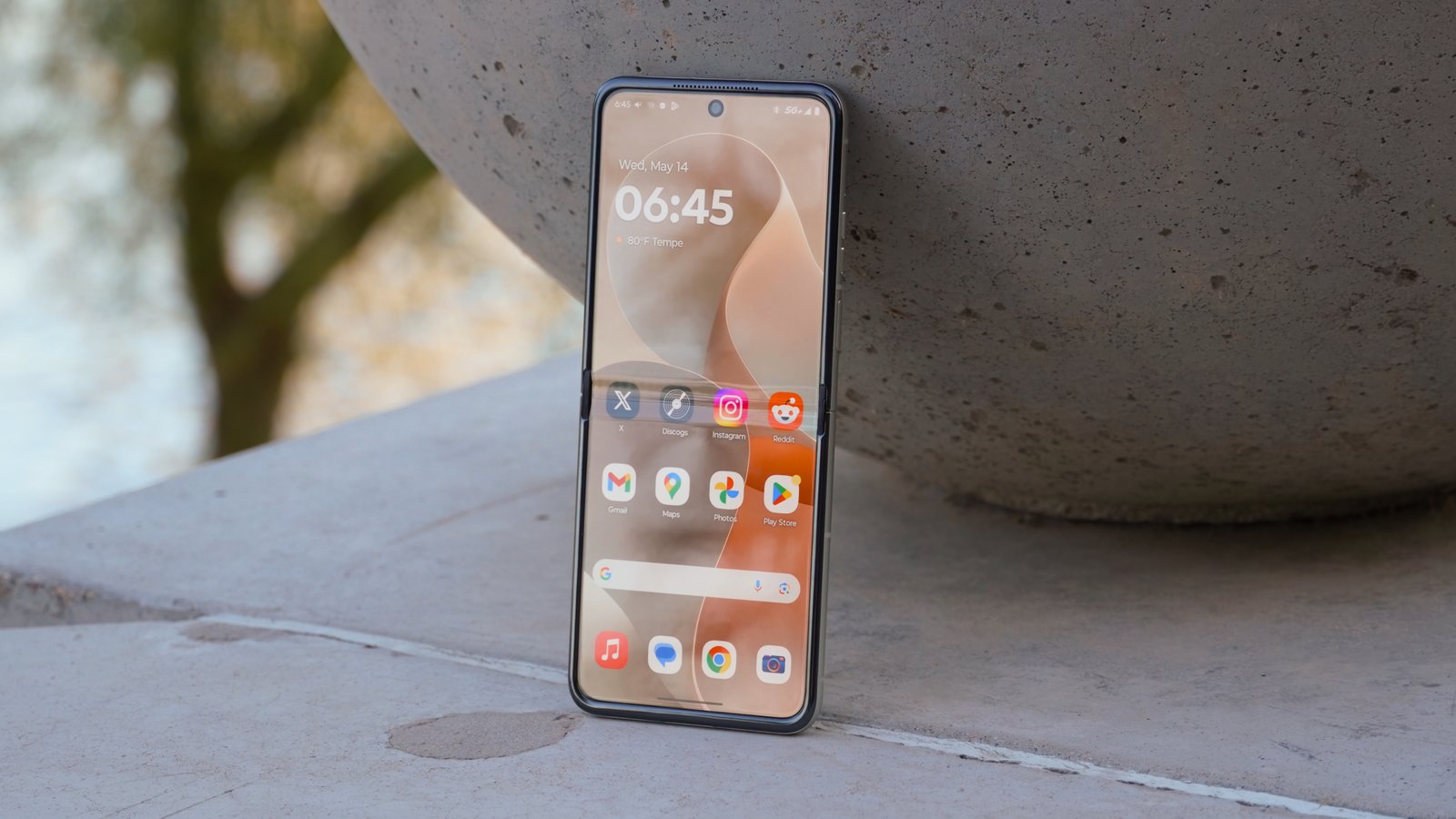 The Motorola Razr 2025 with the display fully opened in the Pantone Lightest Sky colorway.