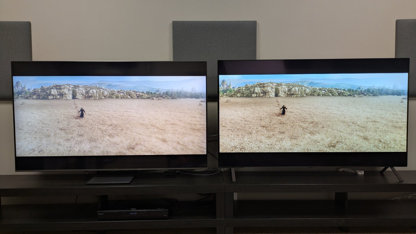 Samsung QN80F and LG B5 showing Elphaba running through a wheat field in Wicked