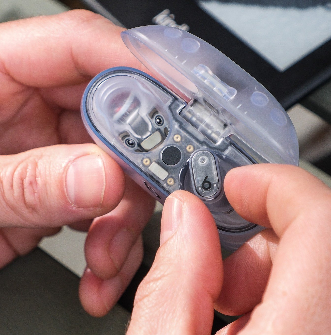 A photo of Beats’ translucent Studio Buds Plus earbuds.