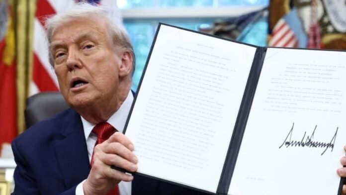 Donald Trump approves TikTok deal through executive order, says China US President Donald Trump shows a signed executive order on a deal that would divest TikTok's US operations from ByteDance from its Chinese owner ByteDance. (Reuters Photo)