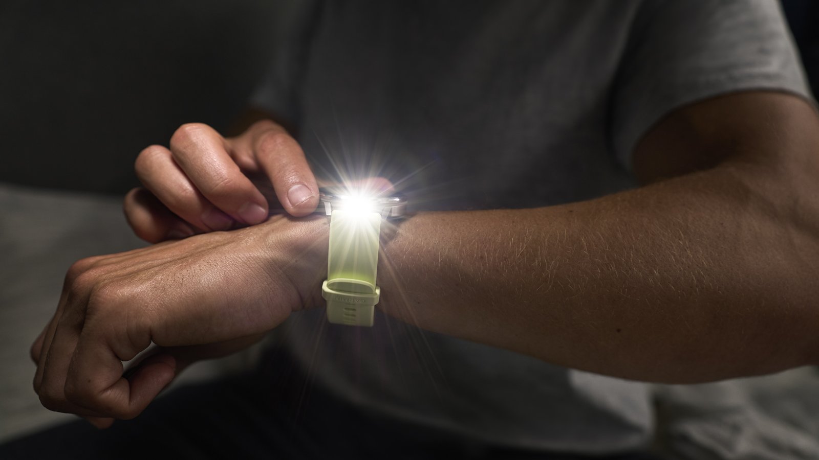 A photo of the Garmin Venu 4 at night with the flashlight on and pointing at the camera.