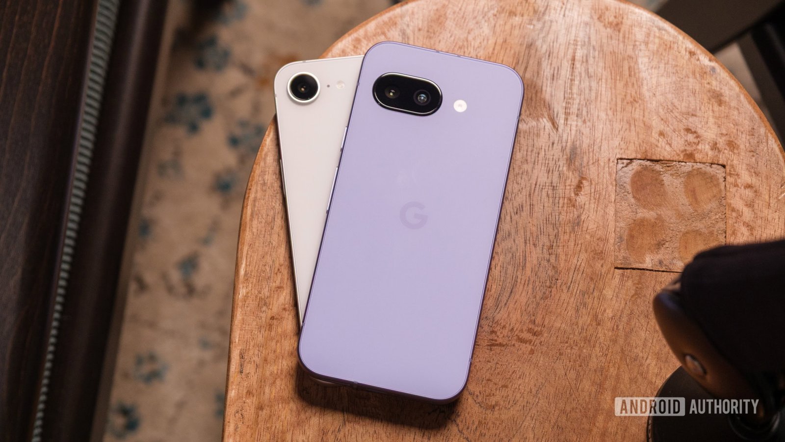 Google Pixel 9a vs iPhone 16e on table