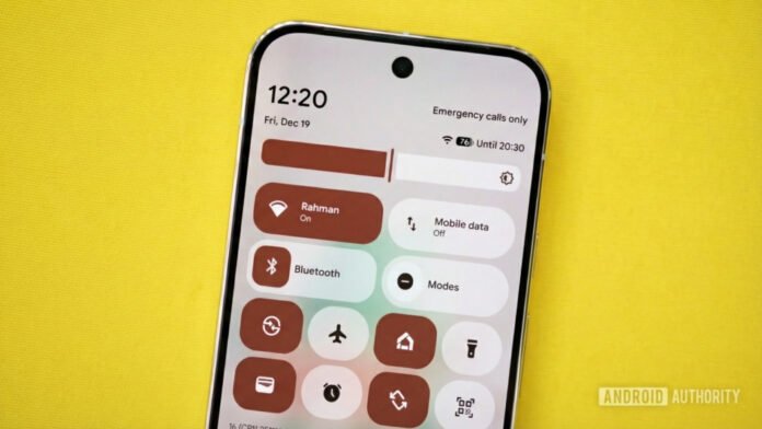 Google may finally reverse this controversial Quick Settings change Image of a Pixel phone with WiFi and mobile data tiles