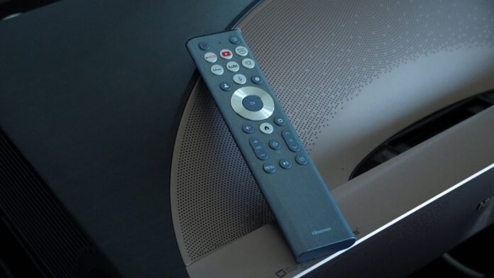 Hisense L9Q projector review: A new ultra short throw benchmark Hisense L9Q remote control on top surface of projector