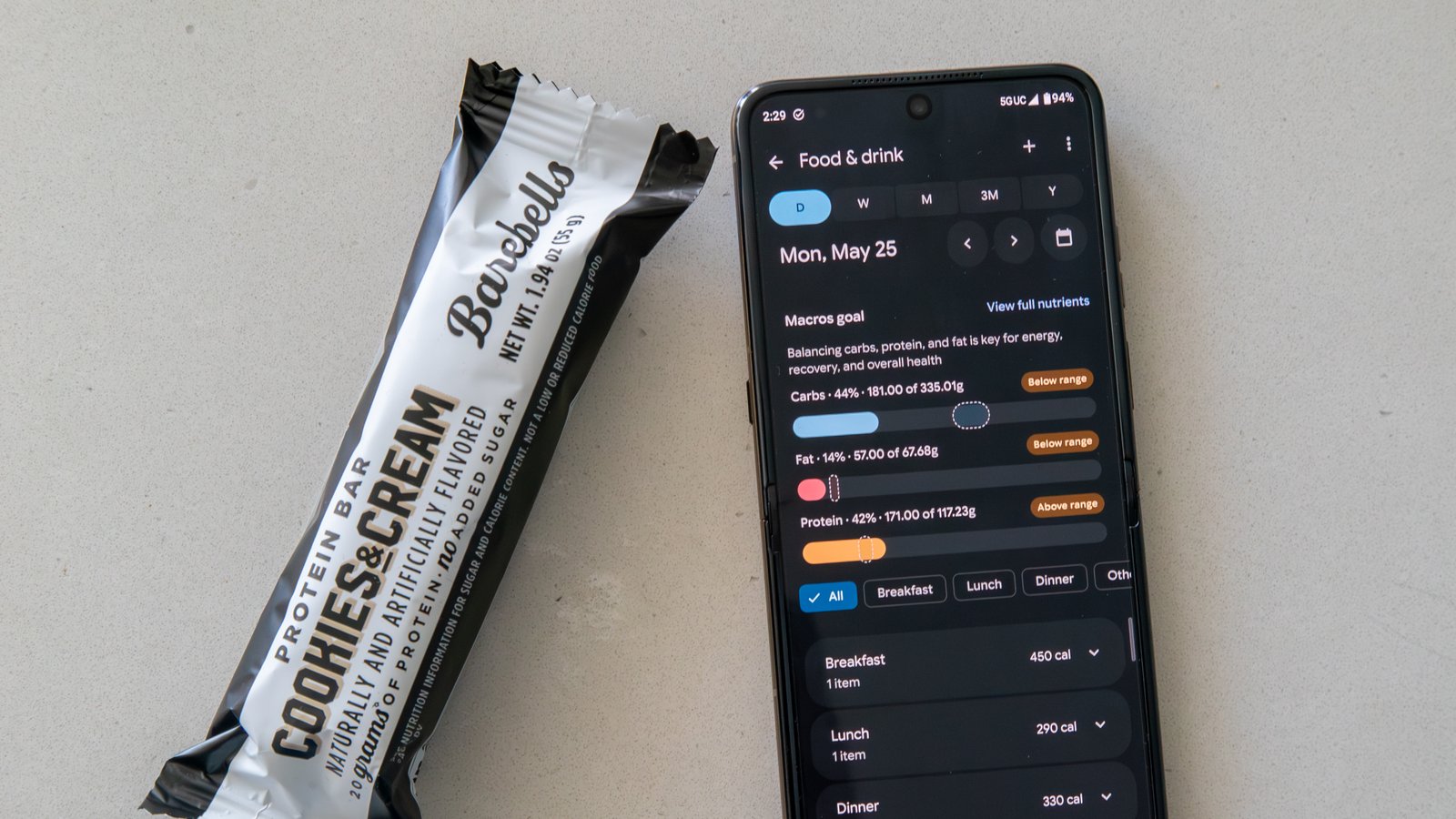 Google Health app food log and a protein bar