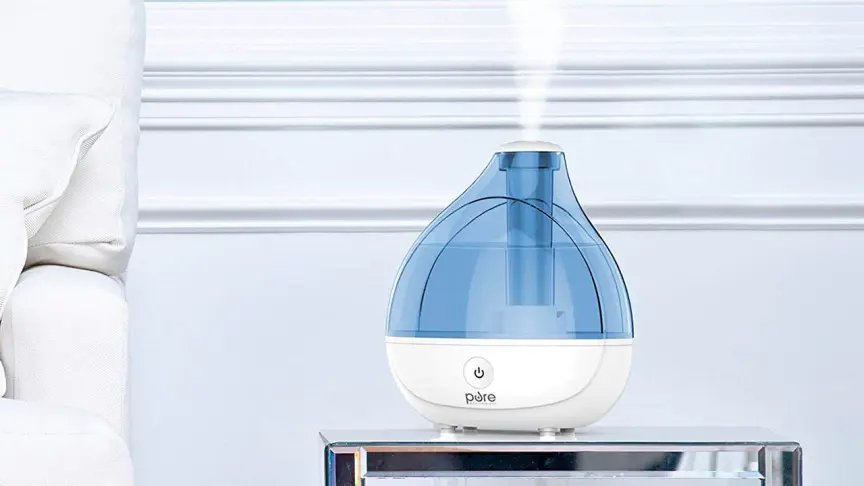 A blue MistAire humidifier in a white room.