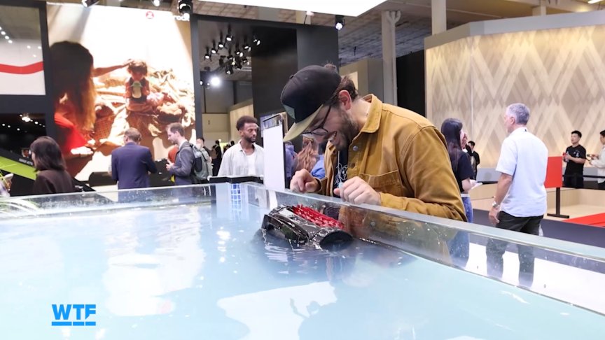 I Went Shopping for My Ultimate Smart Home of the Future at IFA 2026 6 The writer watches a demo of a pool cleaning robot at IFA.