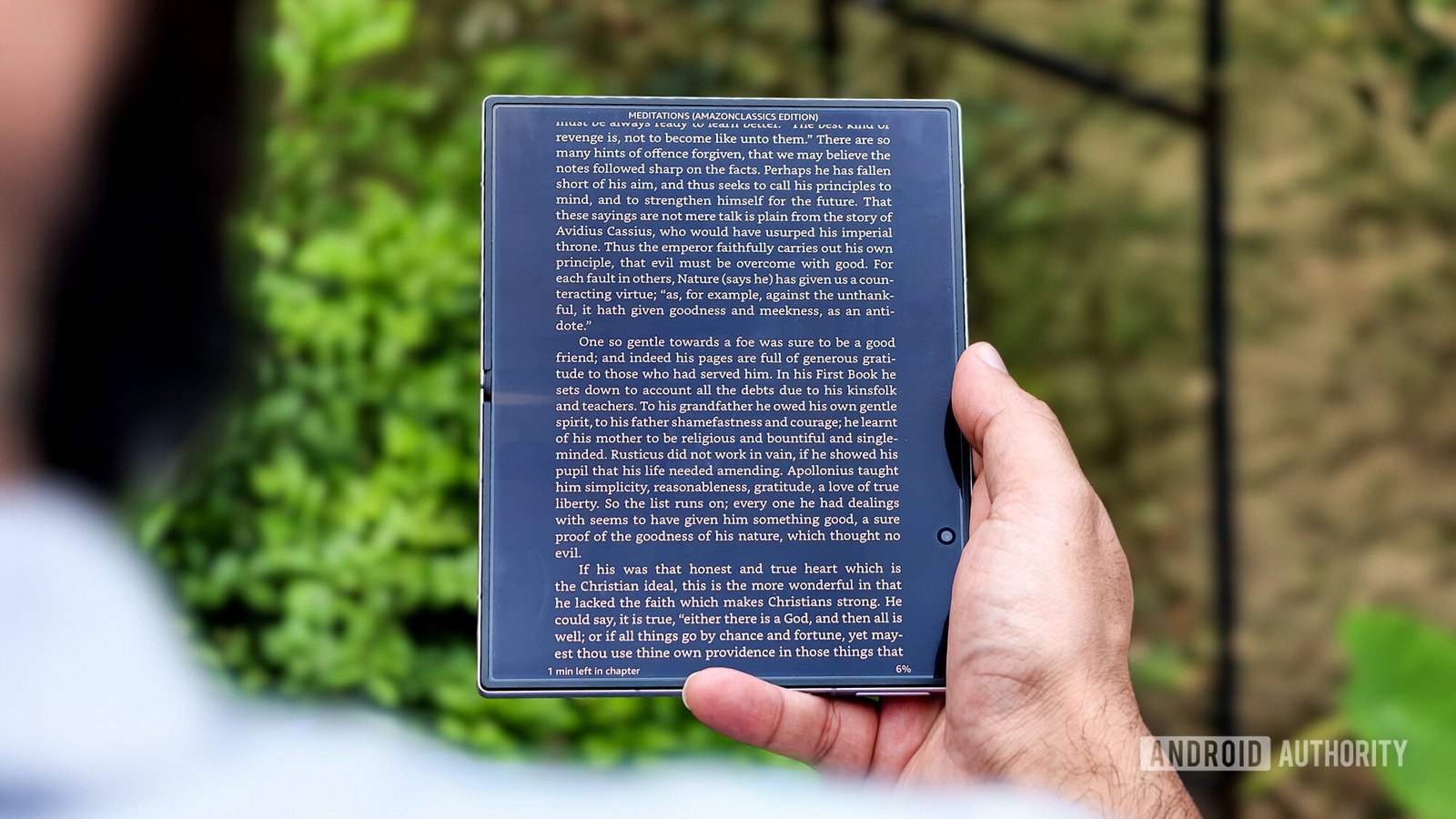 Samsung Galaxy Z Fold in hand reading outdoor